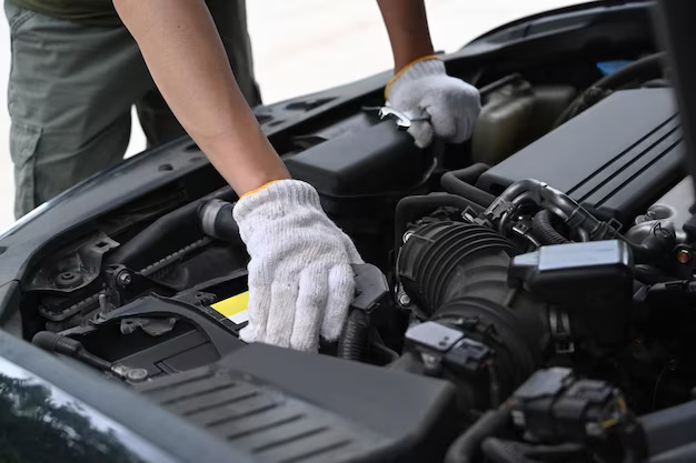 Mechanic inspecting an engine