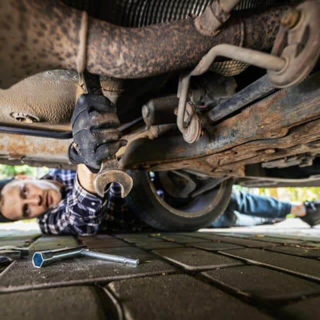 Severely rusted vehicle frame with holes